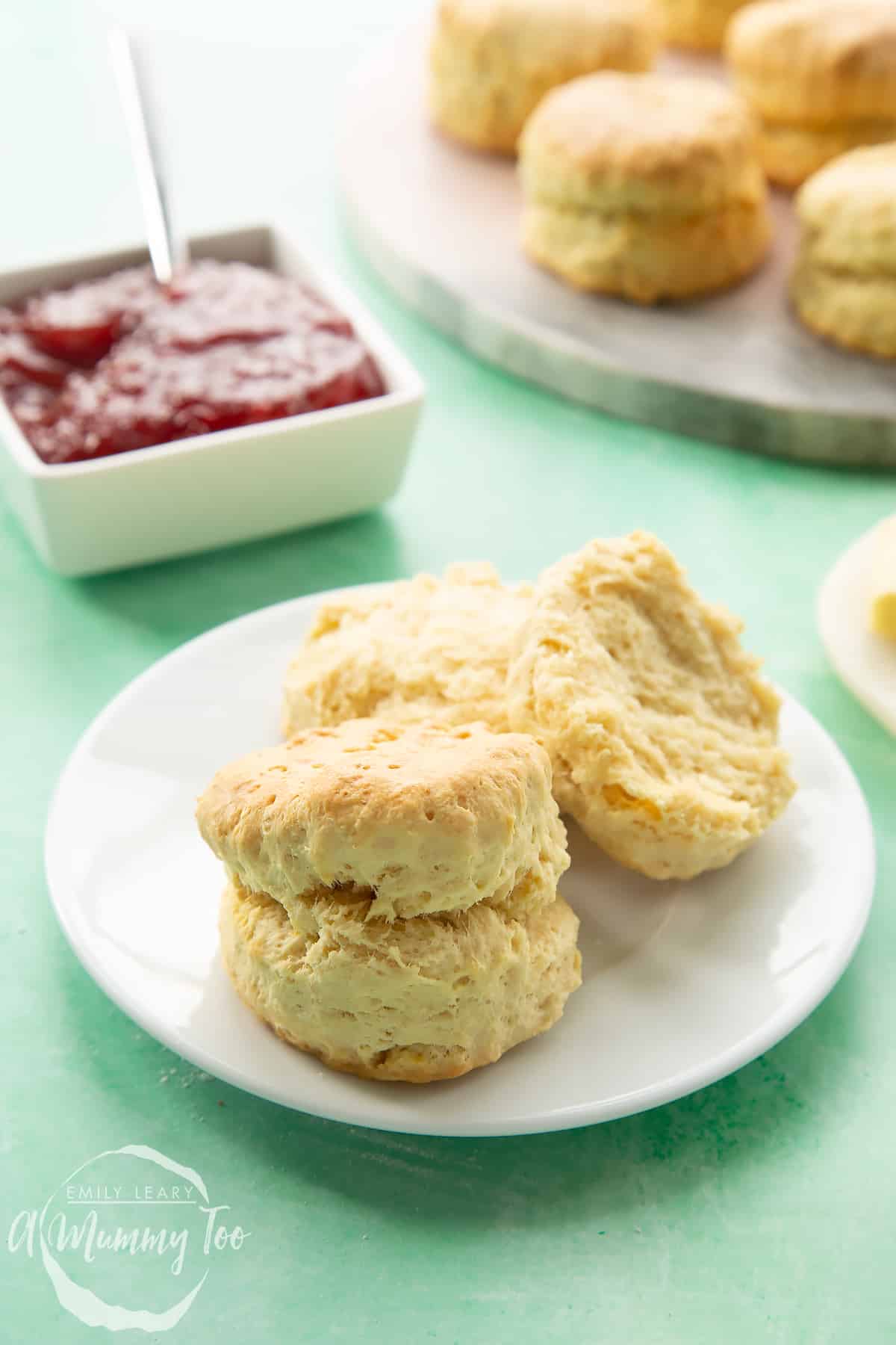 Two dairy free scones on a white plate. 