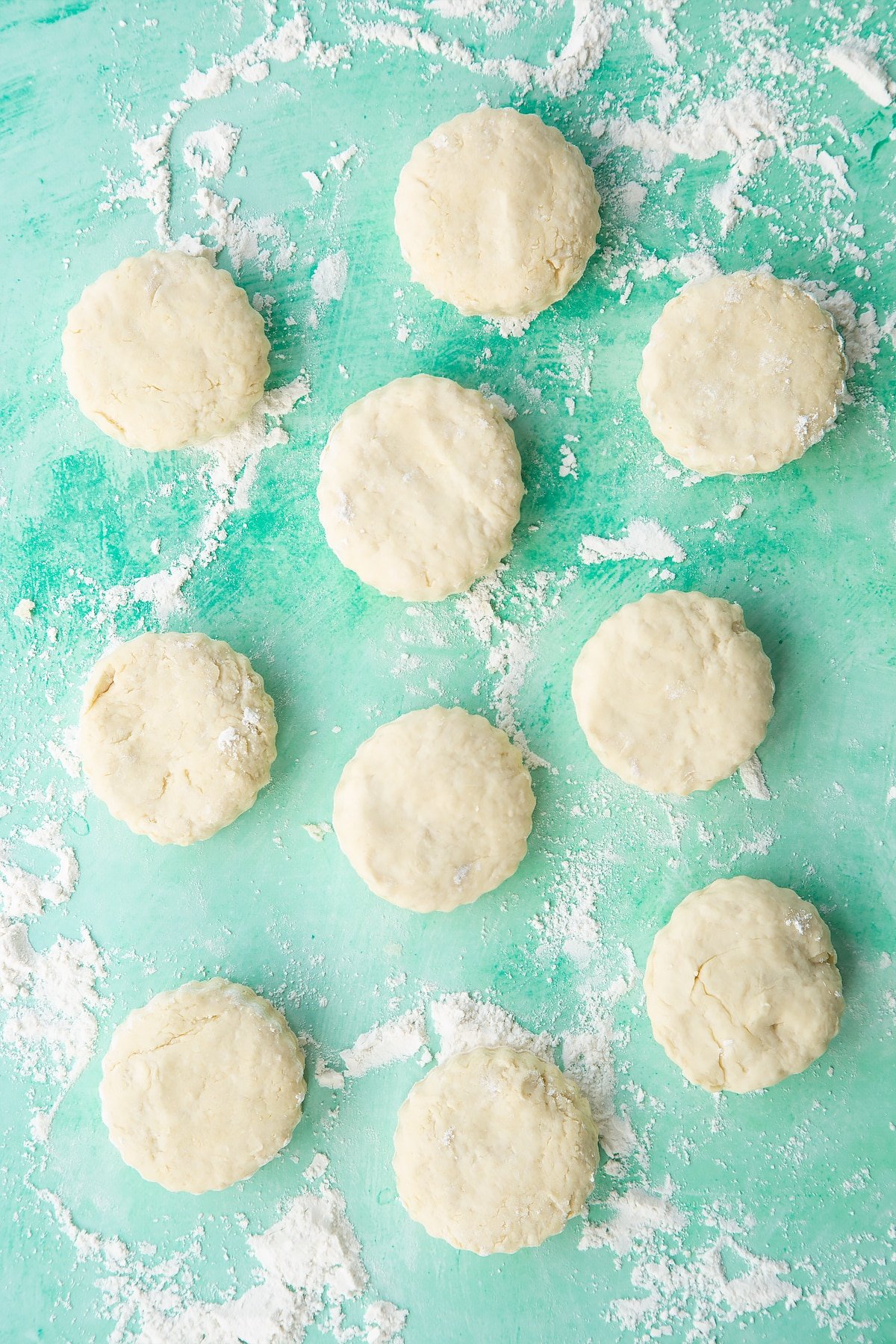 Dairy free scone rounds on a floured surface.