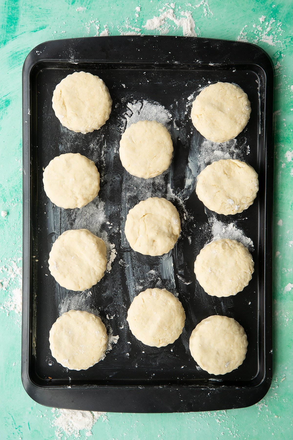 Dairy free scone rounds on a greased baking tray.