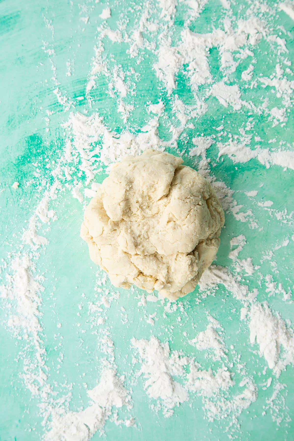 Dairy free scone dough on a floured surface.