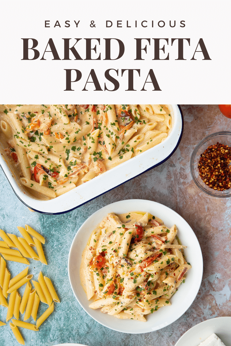 Baked feta pasta in a white bowl, garnished with parsley and chilli flakes. Caption reads: easy & delicious baked feta pasta.