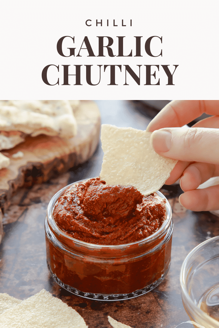 graphic text step-by-step recipe GARLIC CHUTNEY above Overhead shot of a hand holding a piece of bread dipped into garlic puree with website URL below