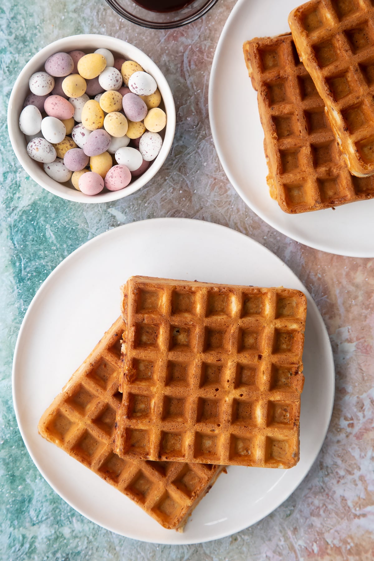 Mini egg waffles on a white plate. 