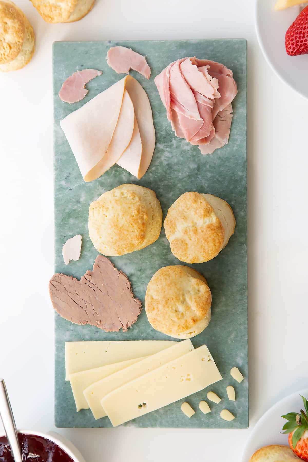 Overhead shot of some of the ingredients required to make a Tom and Jerry afternoon tea. 