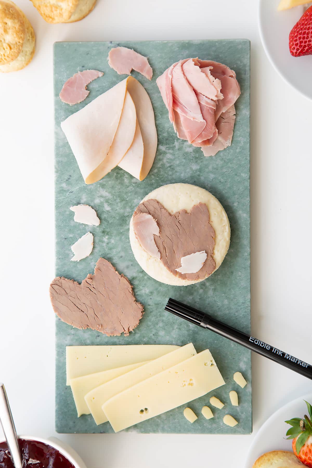 Overhead shot of all the ingredients required to make a Tom and Jerry sandwhich being assembled. 