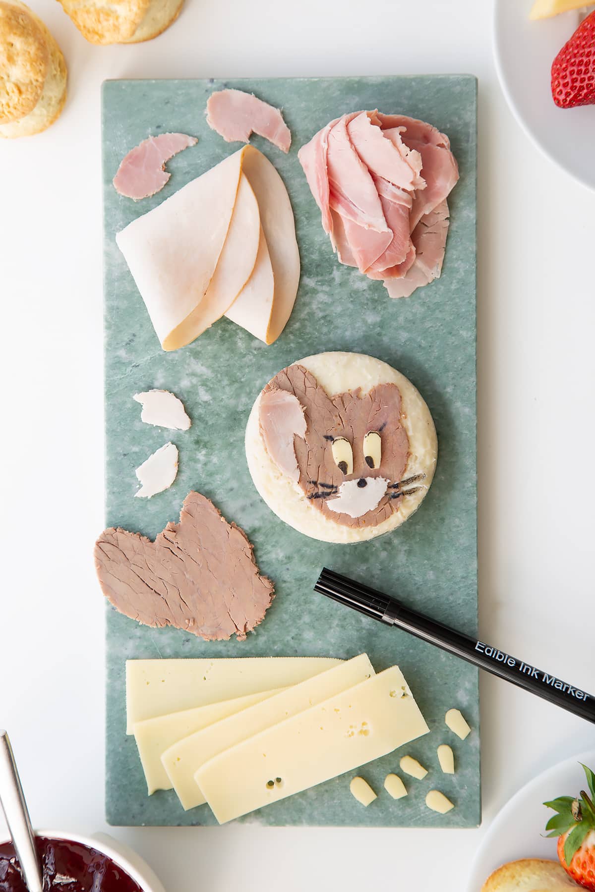 Overhead shot of a Tom and Jerry sandwhich being assembled. 