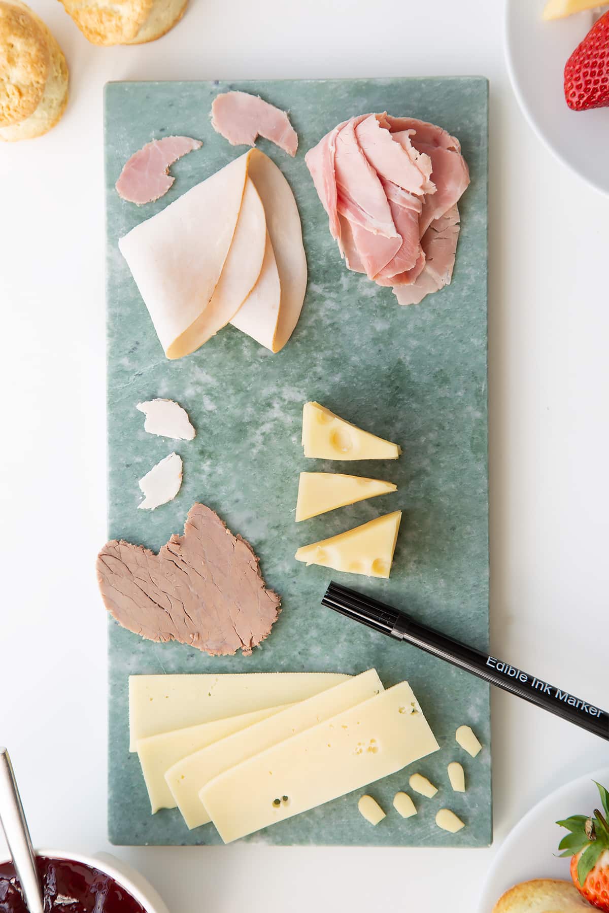 Overhead shot of the ingredients required for a Tom and Jerry afternoon tea. 