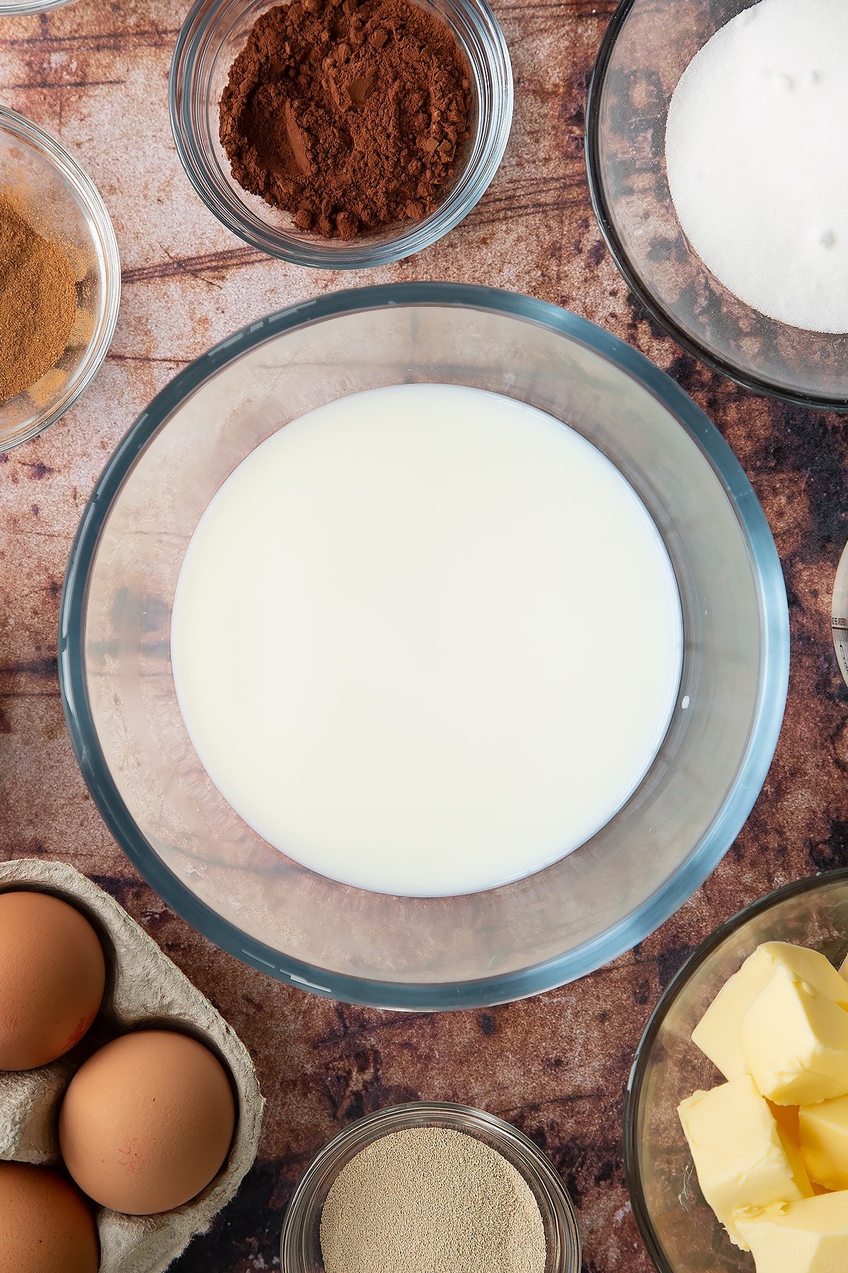 Overhead shot of milk in a large clear bowl