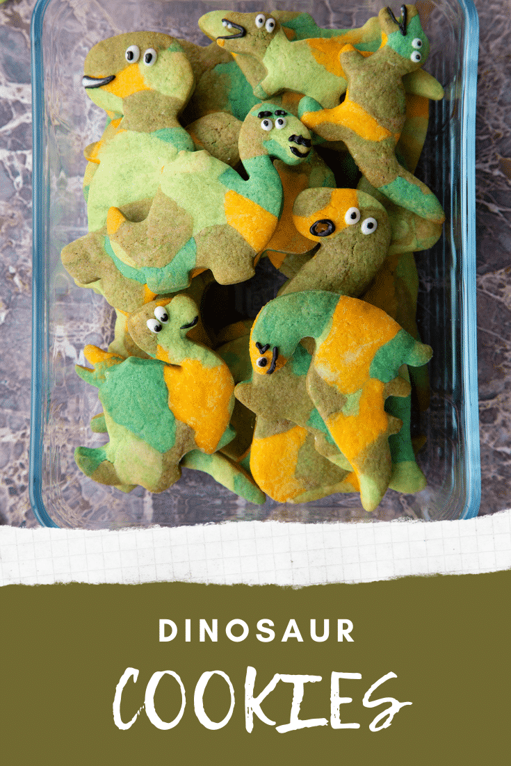 graphic text step-by-step recipe DINOSAUR COOKIES above Overhead shot of dinosaur sugar cookies in a glas dish with website URL below