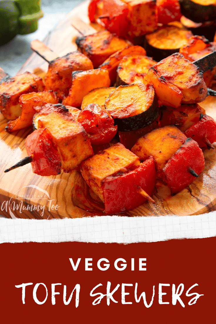 Tofu skewers arranged on a board. Caption reads: Veggie tofu skewers. 