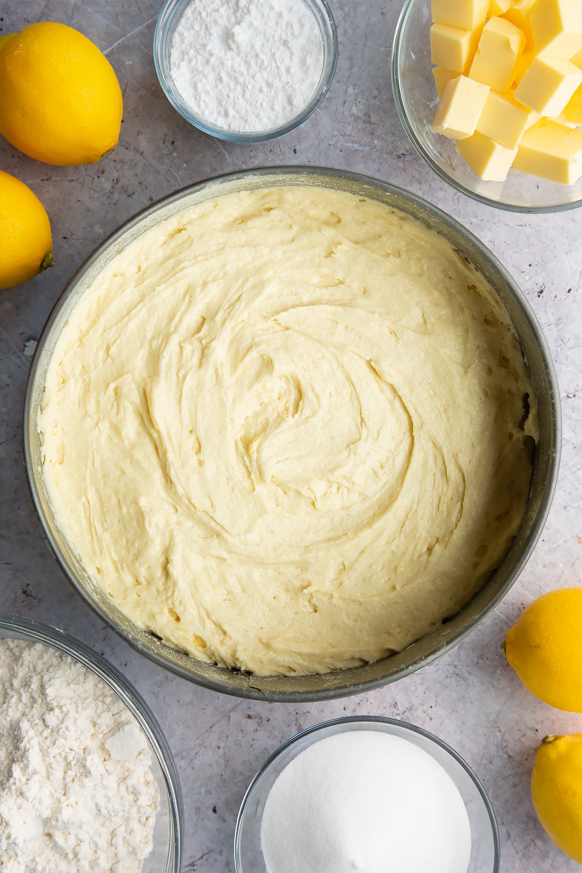 Lemon drizzle cake batter in a cake tin.