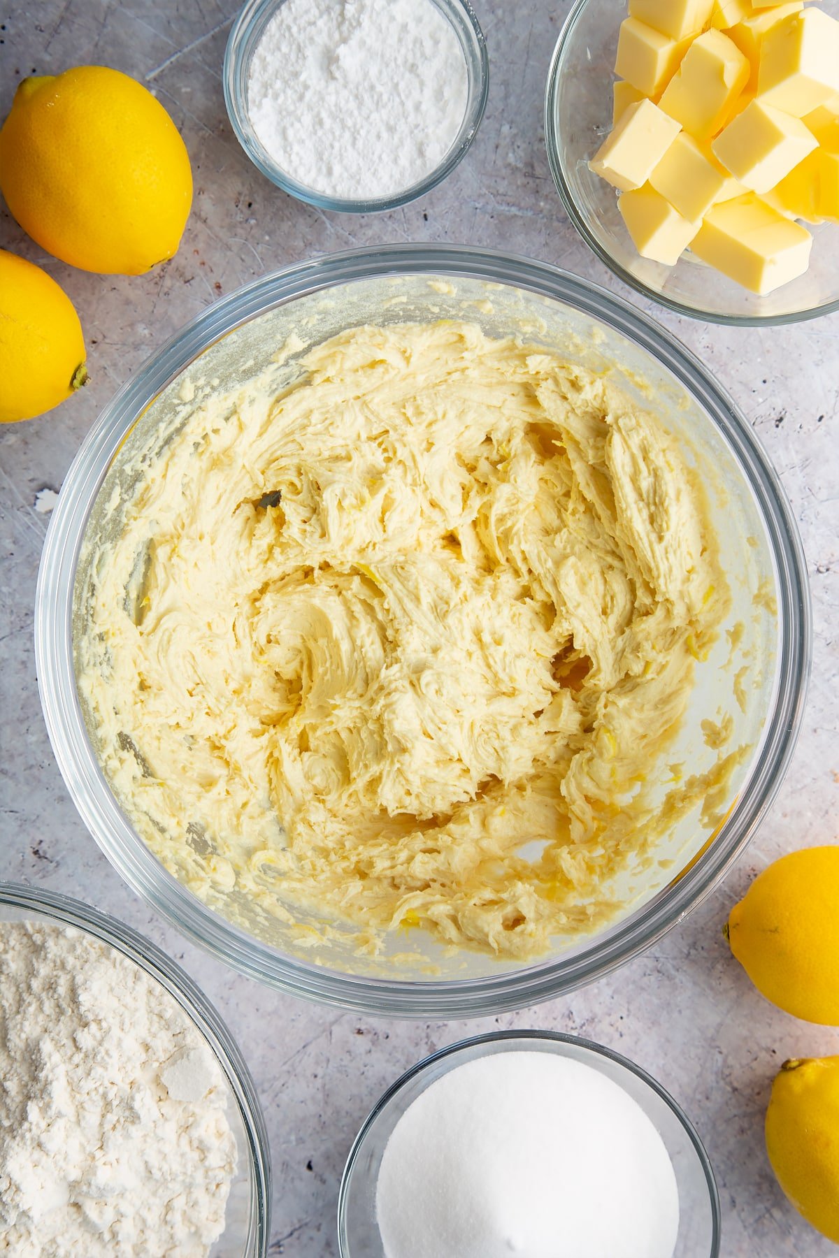 Lemon drizzle cake batter in a glass bowl. 