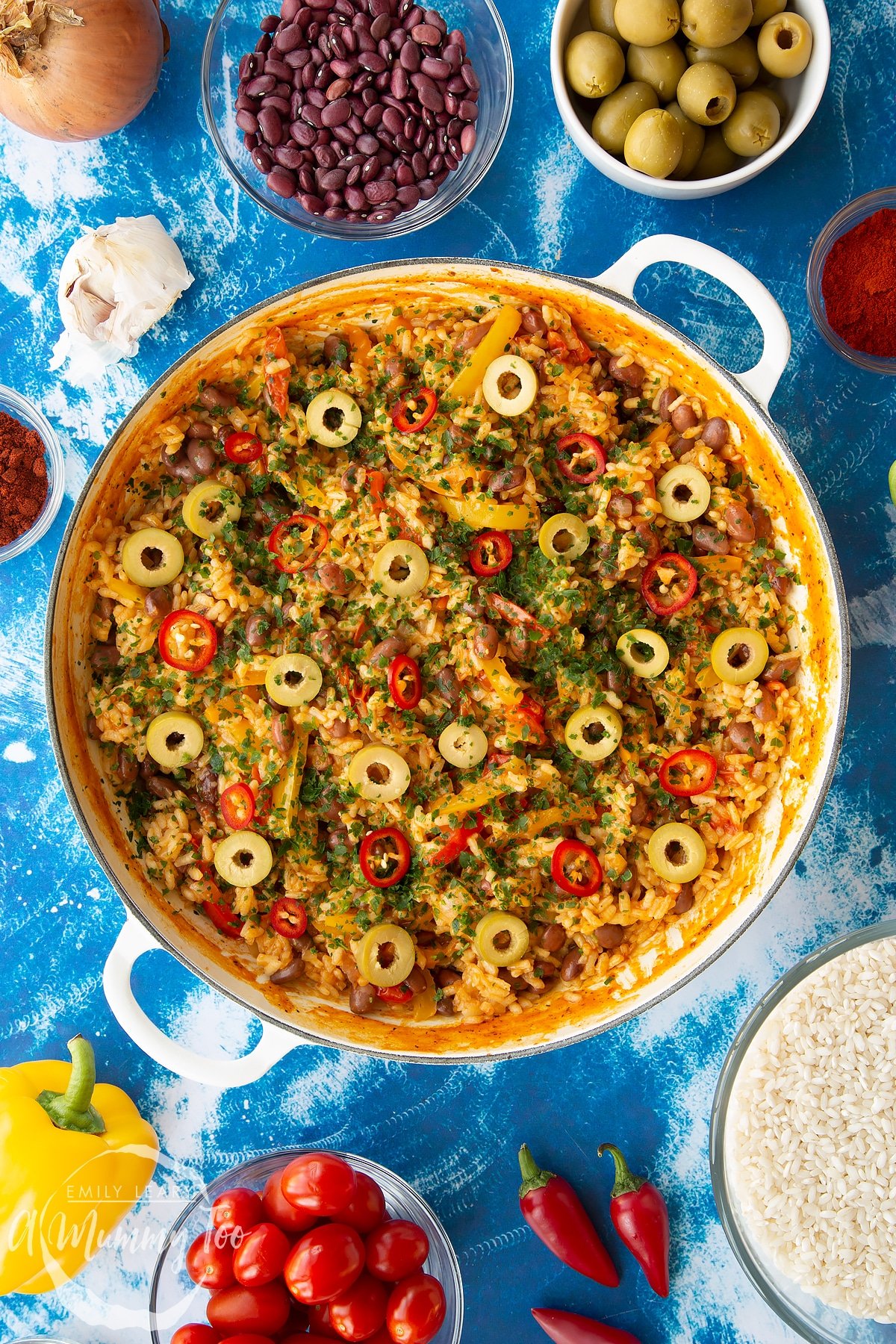 How do you say rice and beans in spanish 14 Easy Spanish rice and beans in a large shallow pot, garnished with olives, chilli and parsley.