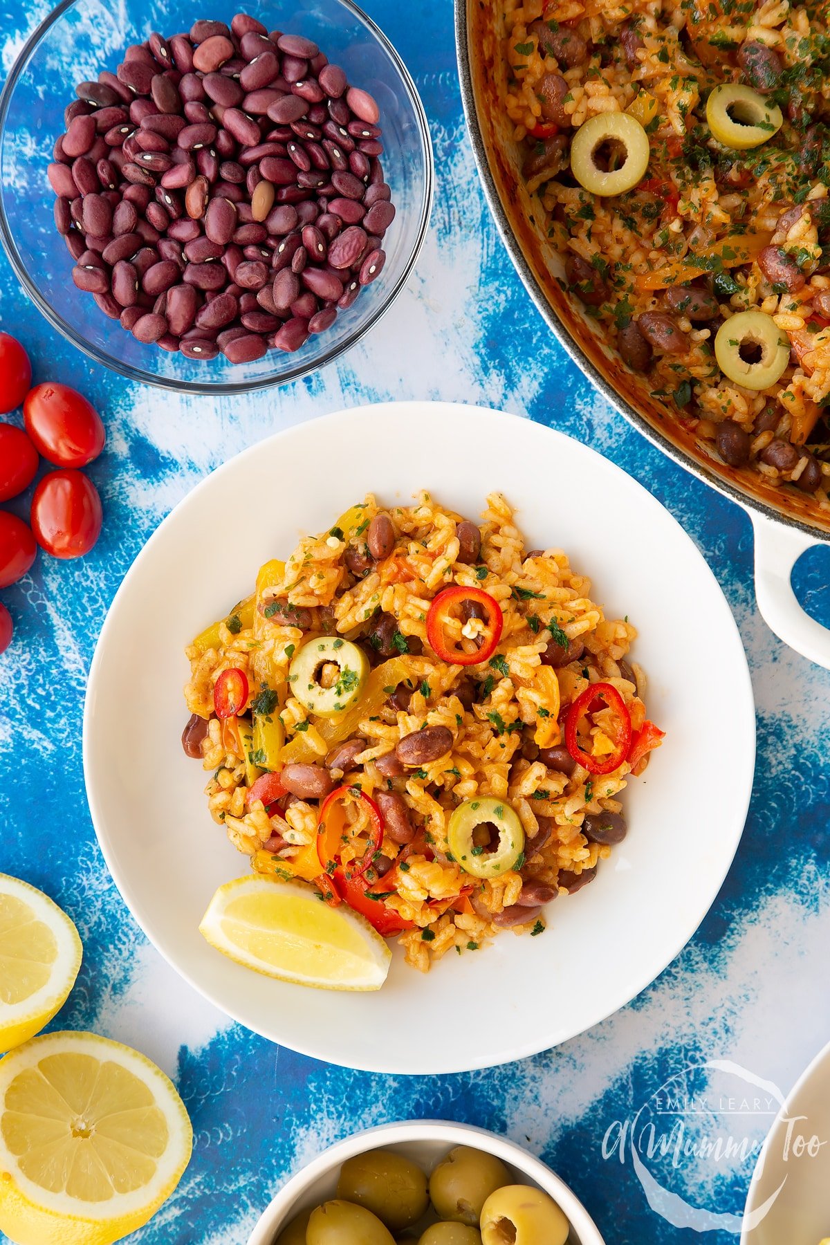 Easy Spanish rice and beans served to a shallow white bowl, shown from above.