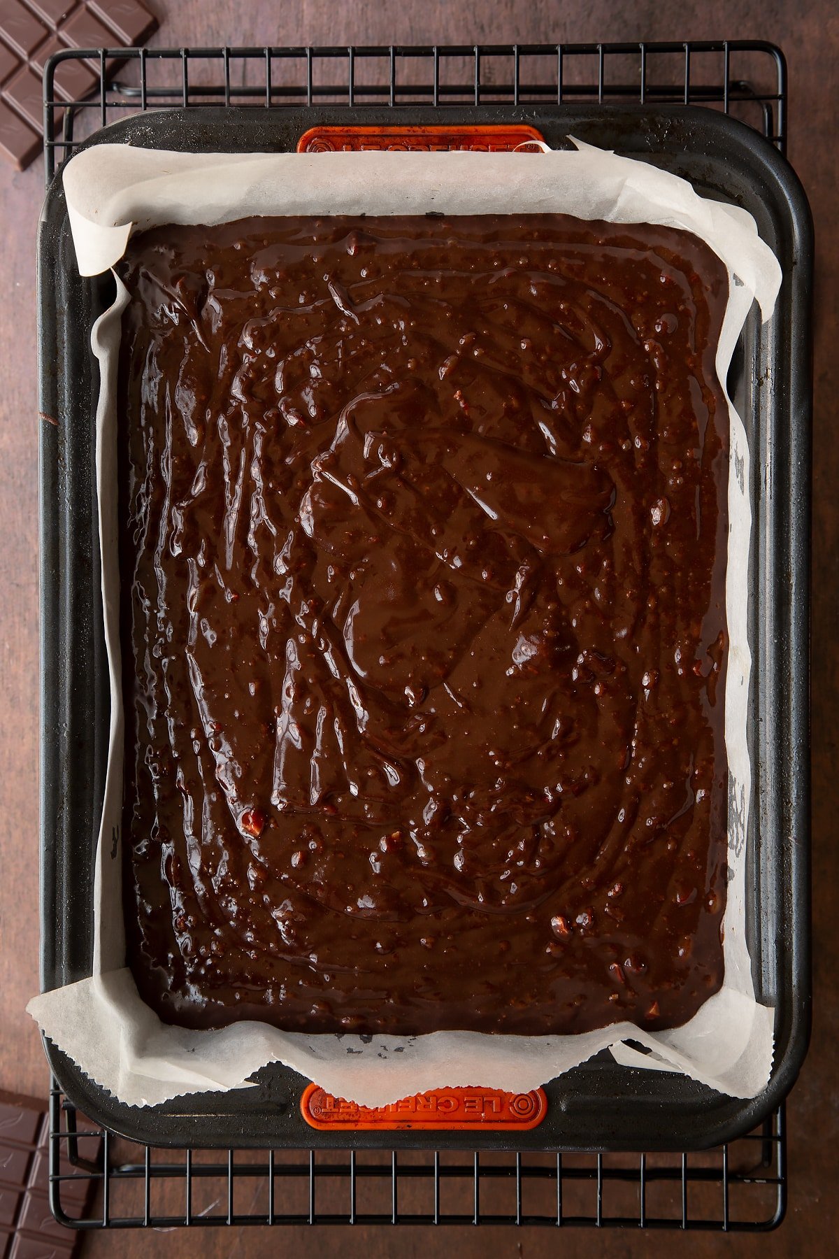 Candy cane brownie batter in a lined tin. 