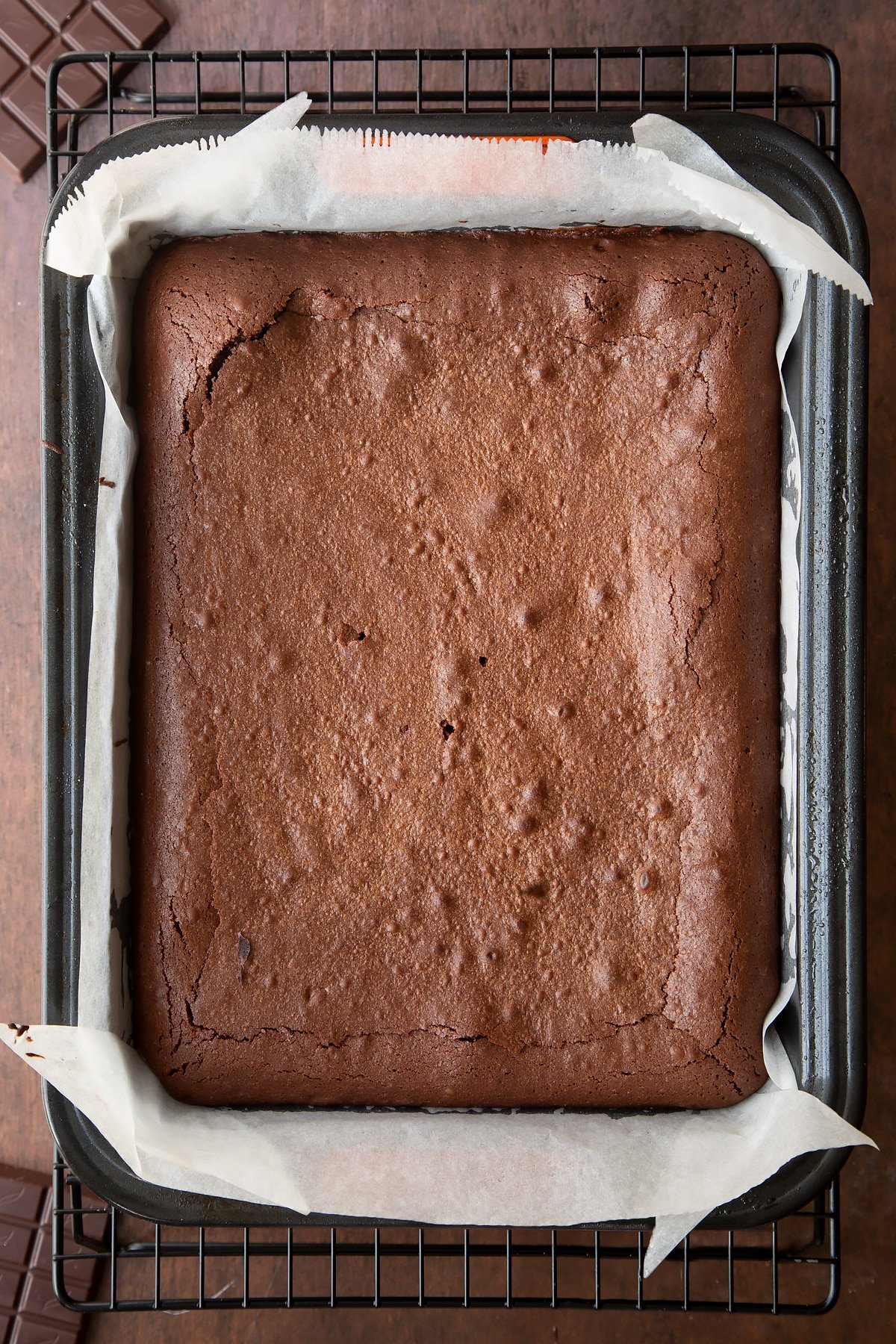 Freshly baked candy cane brownies in a lined tin. 