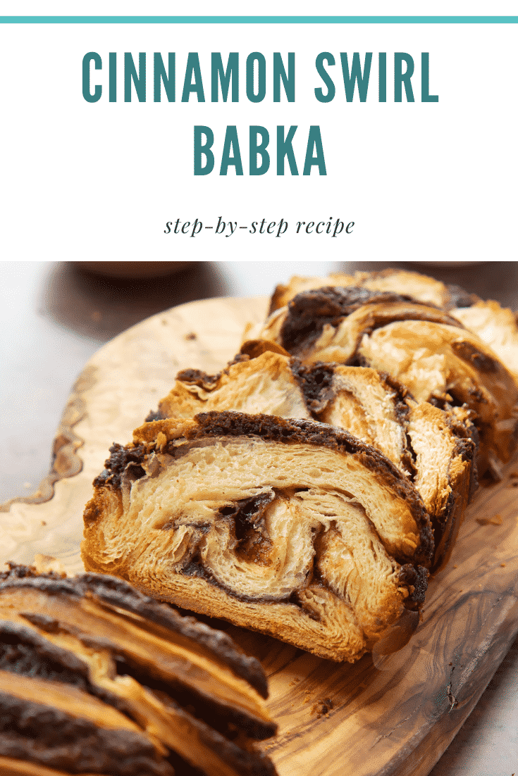 Slices of cinnamon swirl babka on a wooden board. Caption reads: cinnamon swirl babka step-by-step recipe