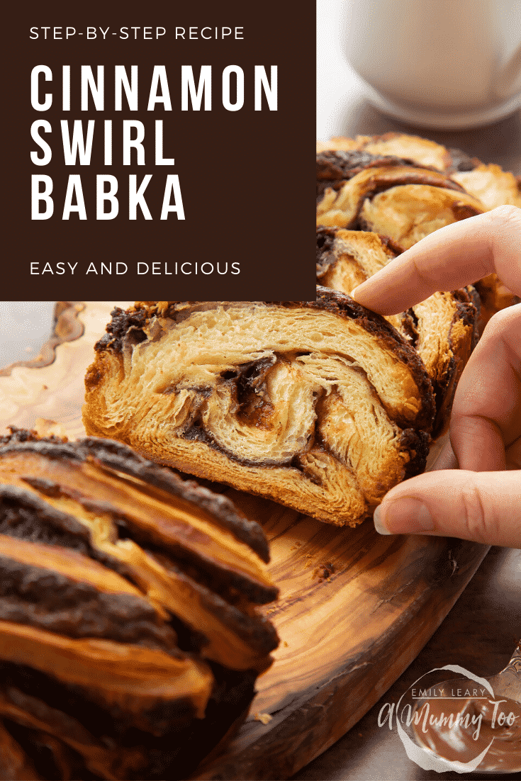 Hand reaching for a slice of cinnamon swirl babka on a wooden board. Caption reads: step-by-step recipe cinnamon swirl babka easy and delicious