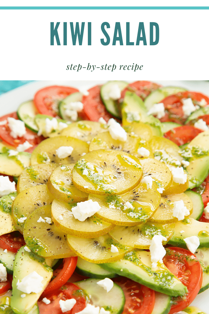 Close up of kiwi feta salad on an oval white platter. Caption reads: Kiwi feta salad. Step-by-step recipe.