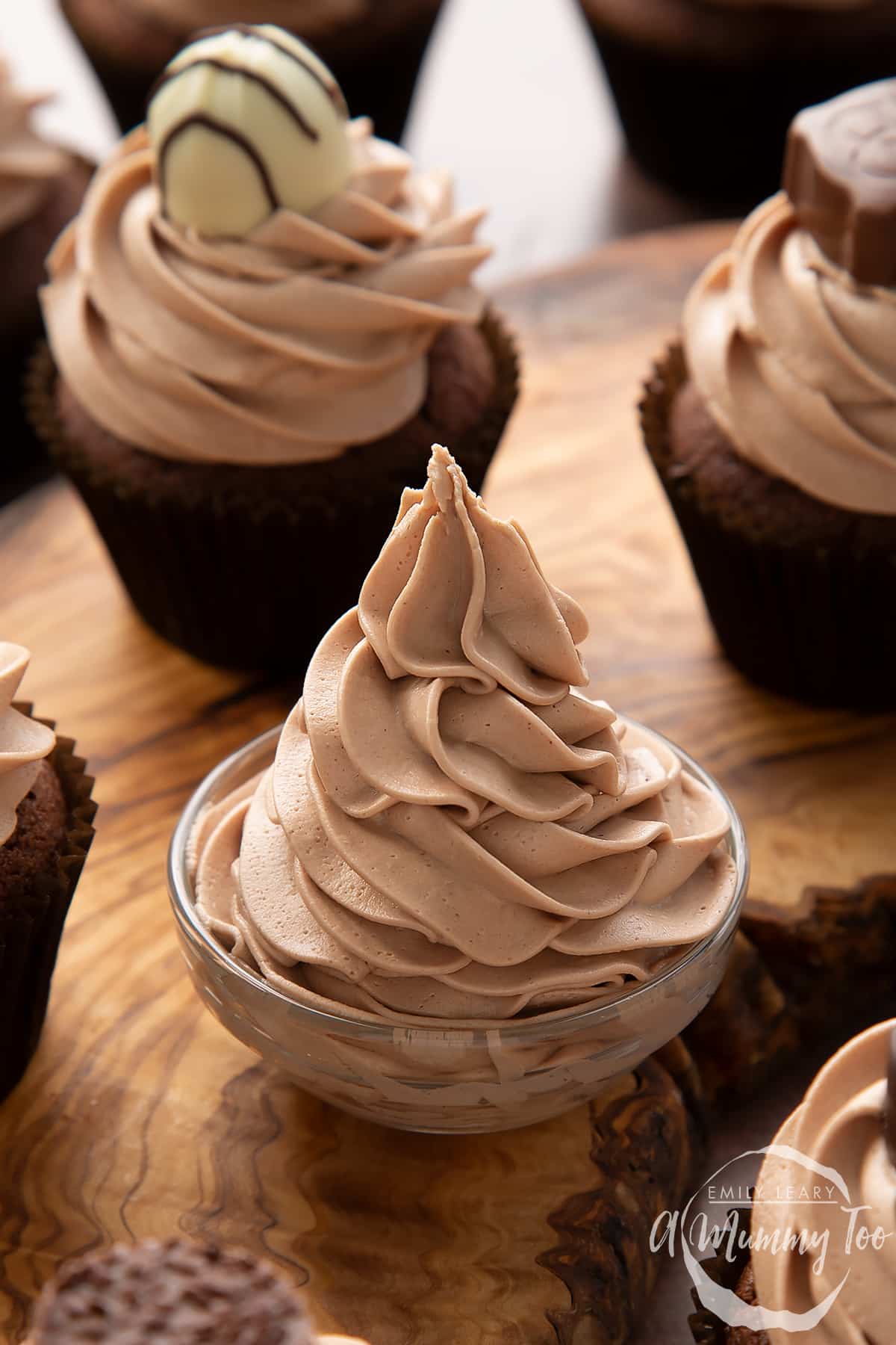 Baileys icing piped into a small glass bowl.