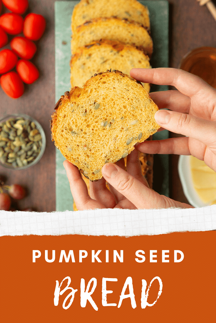 Hands holding a slice of pumpkin seed bread. Caption reads: Pumpkin seed bread.