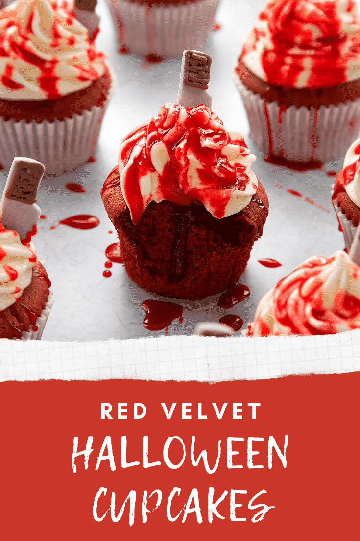 Red velvet Halloween cupcake, spattered with red syrup, with a bite out of it. Caption reads: Red velvet Halloween cupcakes.