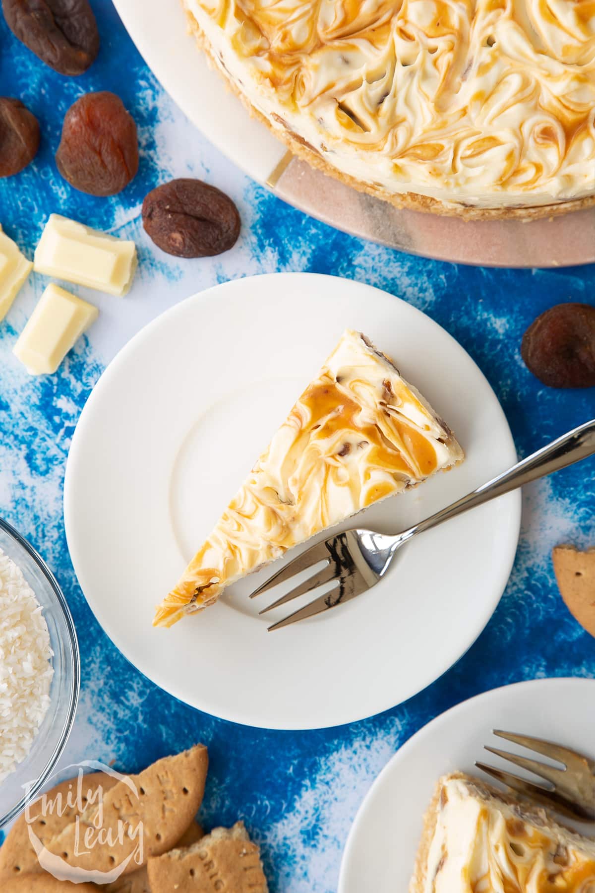 Slice of caramelised apricot cheesecake on a white plate.