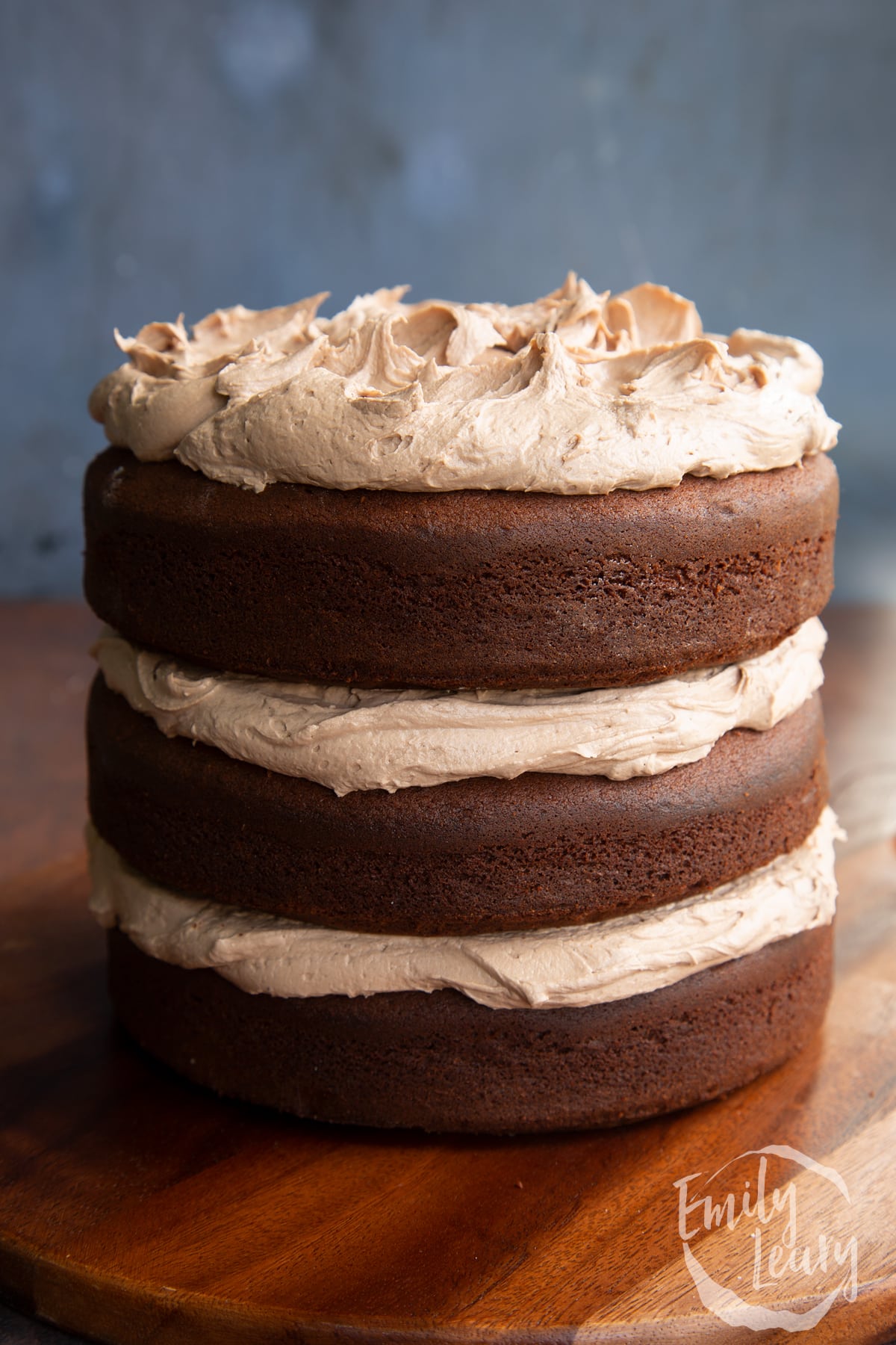 Three tier chocolate Baileys cake, sandwiched and topped with Baileys buttercream frosting.