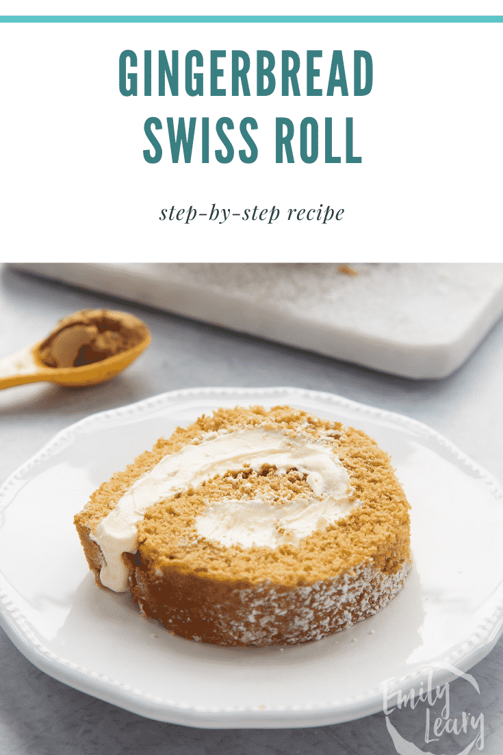 A slice of gingerbread Swiss roll on a white plate with a fork. Caption reads: Gingerbread Swiss roll. Step by Step recipe.