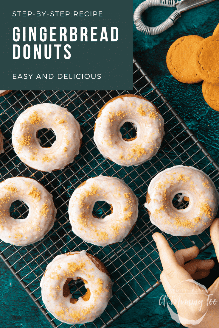 Baked gingerbread donuts with a lemon glaze on a wire cooling rack. A hand reaches for one.  Caption reads: Step-by-step recipe. Gingerbread donuts. Easy and delicious.