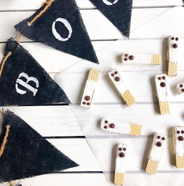 Chocolate wafer ghost cookies on a white background.