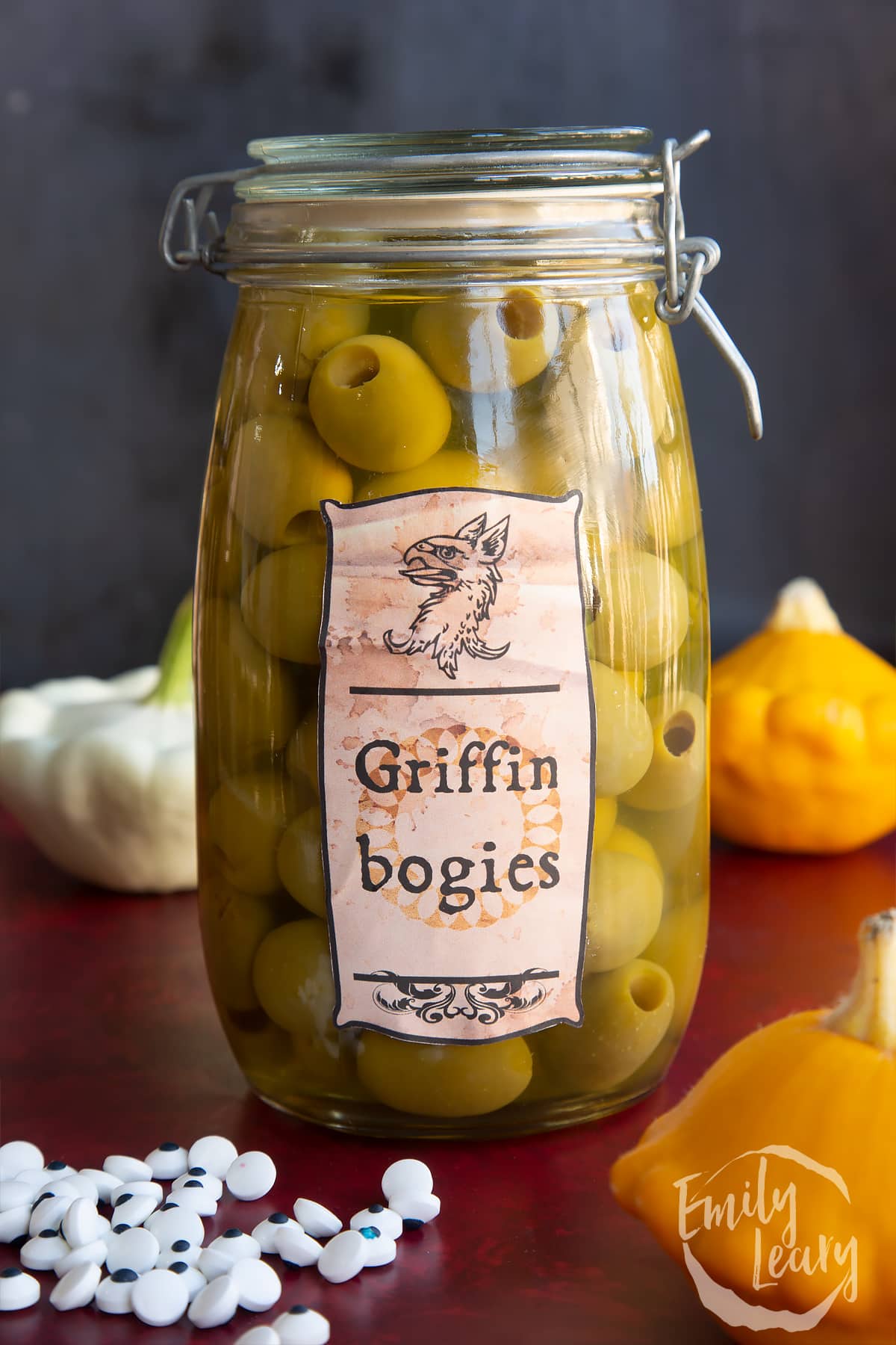 A large jar of green olives bearing a Halloween apothecary label that reads: Griffin bogies.