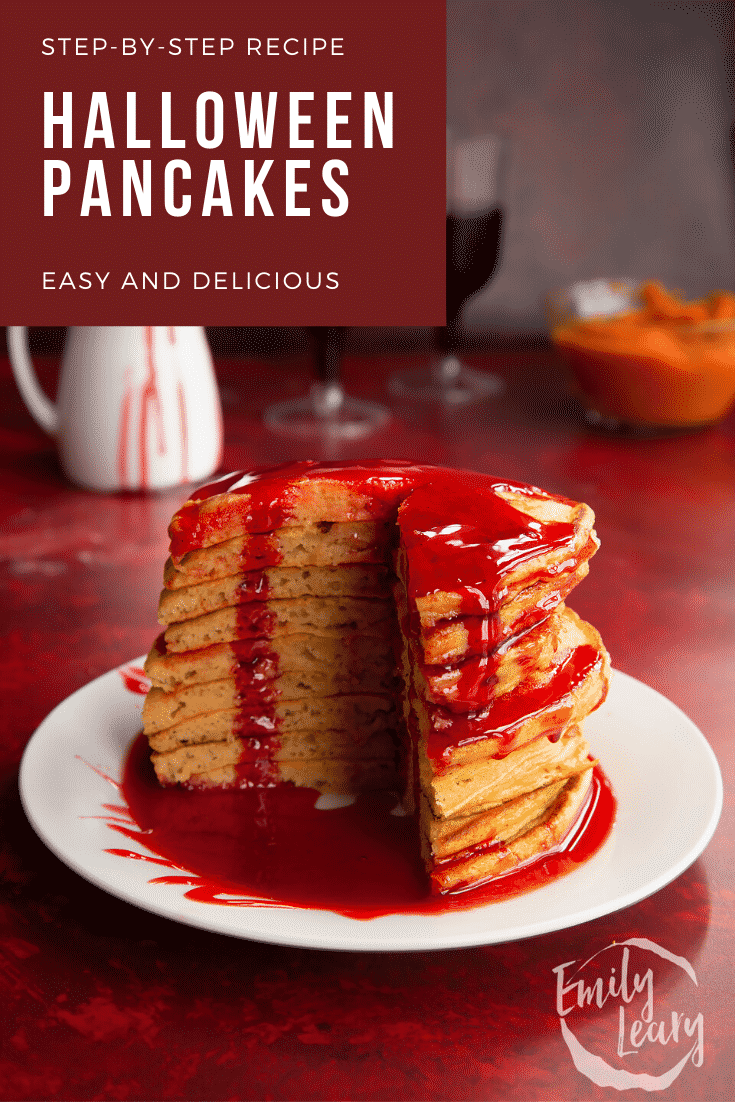 Halloween pancakes stacked on a white plate, drizzled with red syrup. A section has been cut away. Caption reads: Step-by-step recipes. Halloween pancakes. Easy and delicious.