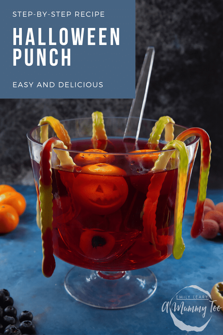 Halloween punch, decorated with fruit and gummy snakes. Caption reads: Step-by-step recipe Halloween punch. Easy and delicious.