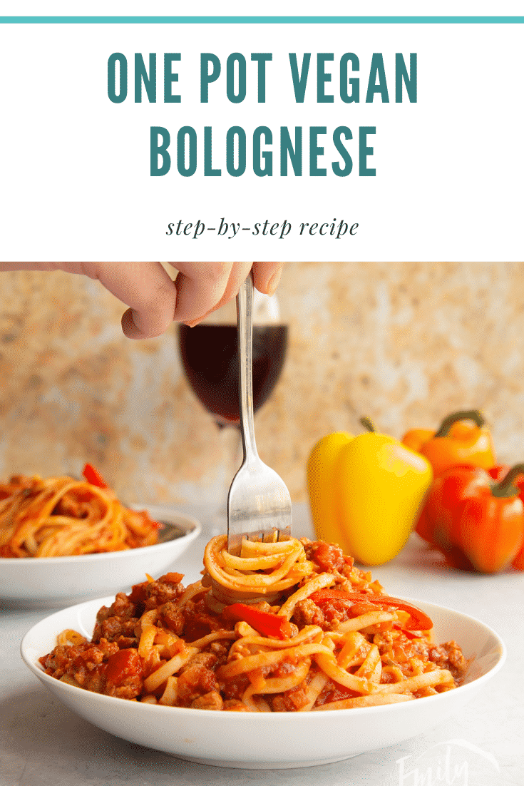 One pot vegan bolognese in a shallow white bowl. A hand delves a fork, twisting spaghetti in the bowl. Caption reads: One pot vegan bolognese step-by-step recipe