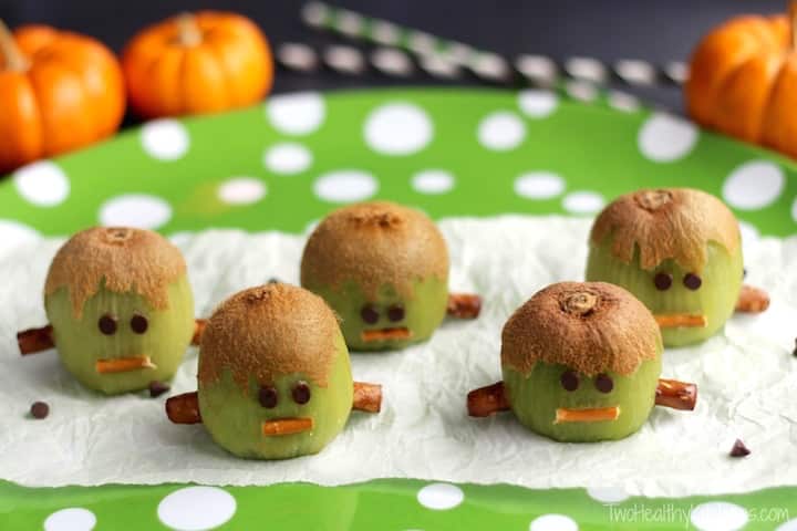 Kiwis trimmed to look like Frankenstein's monster, with pretzel decorations.