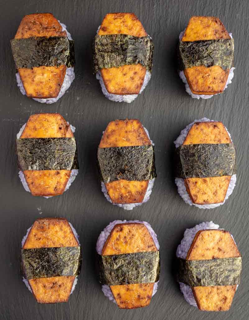 Halloween coffin musubi - a type of such with purple stained rice topped with coffin-shaped slices of tofu.