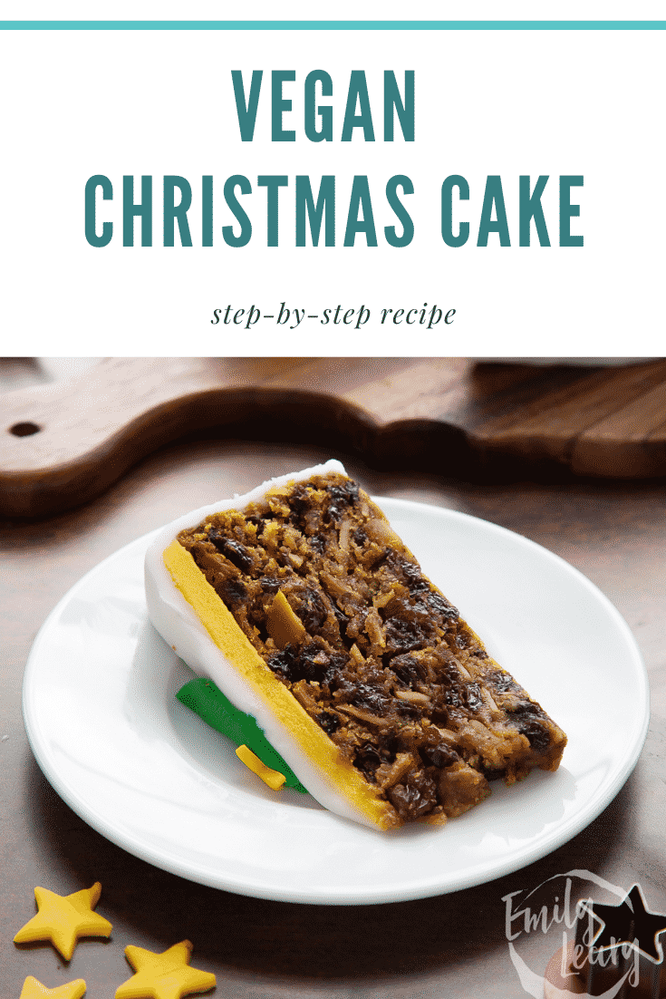 Slice of vegan Christmas cake on a white plate. Caption reads: Vegan Christmas cake. Step-by-step recipe.