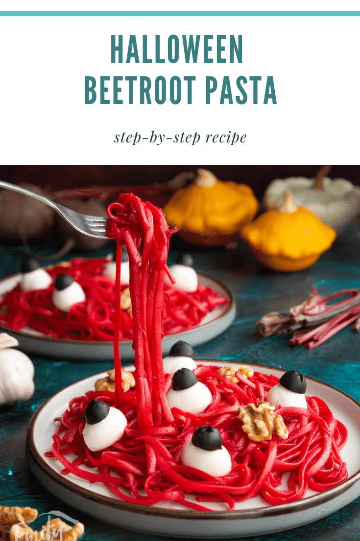 A plate with a beetroot Halloween pasta recipe, topped with mozzarella eyes and walnut brains. A fork lifts some pasta. Caption reads: Halloween beetroot pasta. Step-by-step recipe