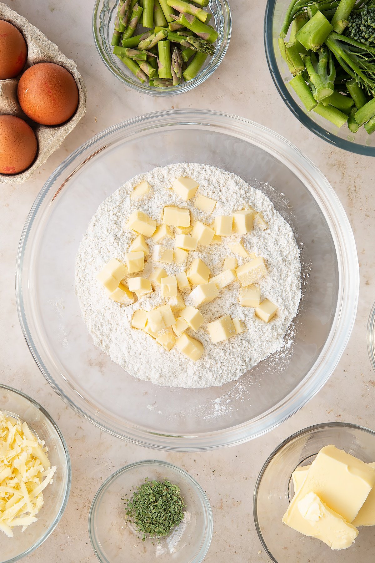 Overhead shot of butter and flour in a mixing bowl.