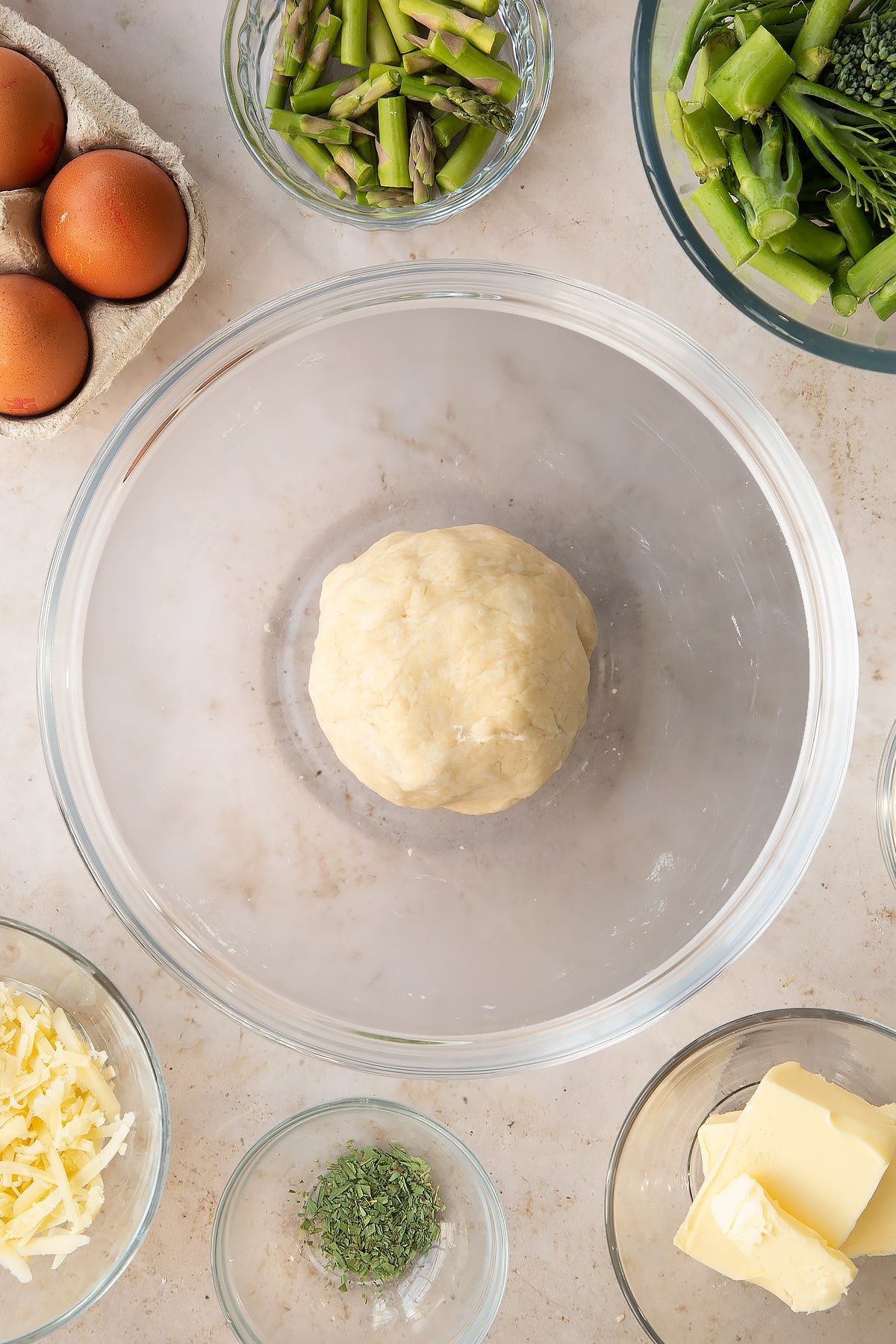 Overhead shot of the pastry mixture having been rolled into a ball.