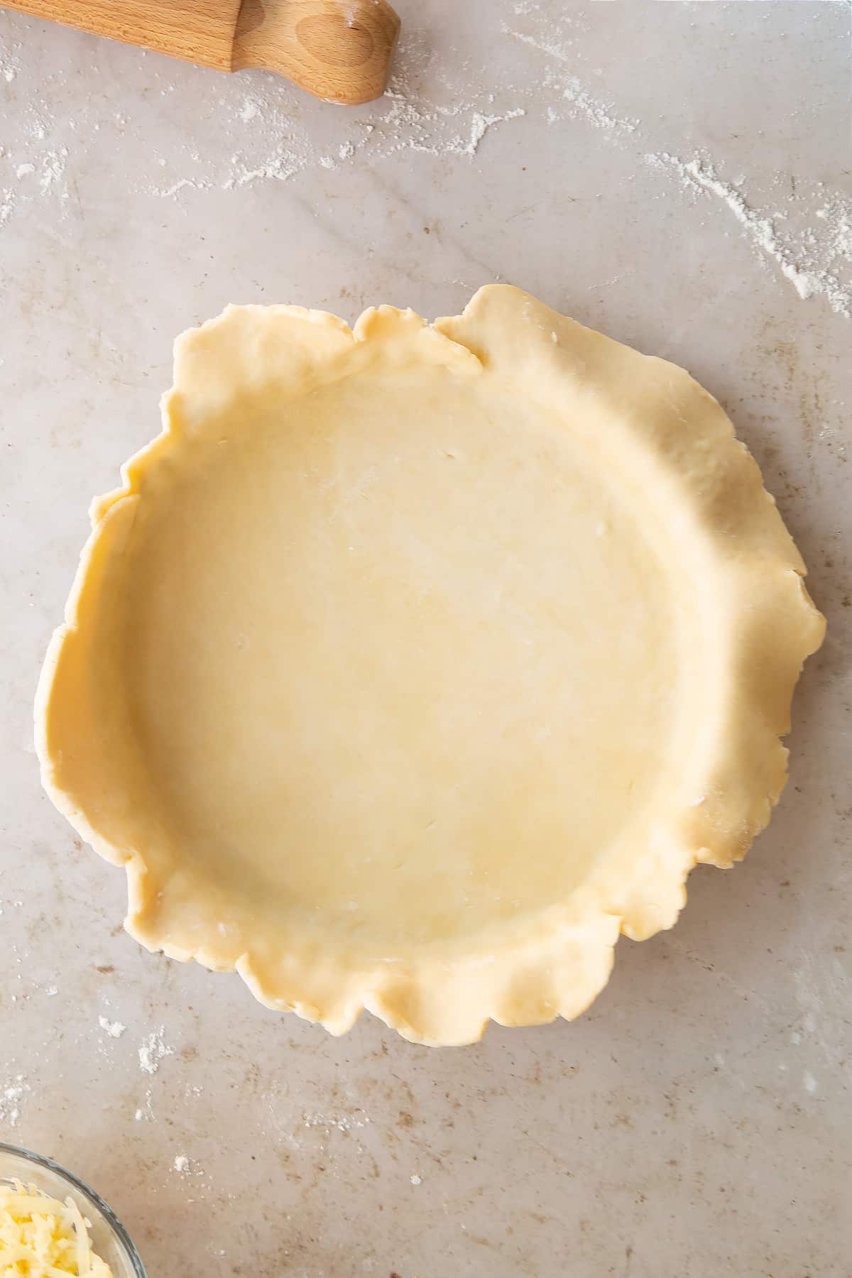 Overhead shot of the pastry for the chestnut quiche having been put inside a pie tin.