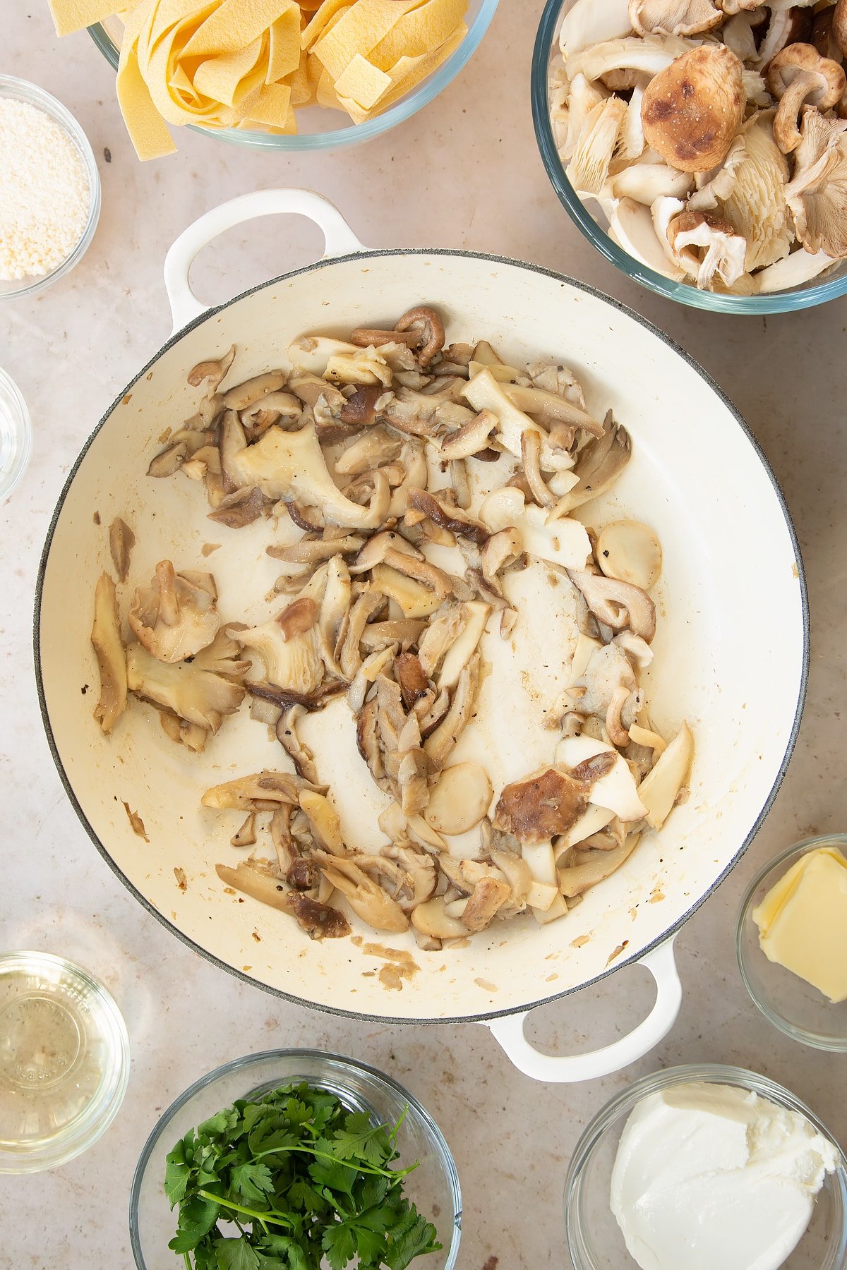 cooked garlic and mushrooms in a large pan.