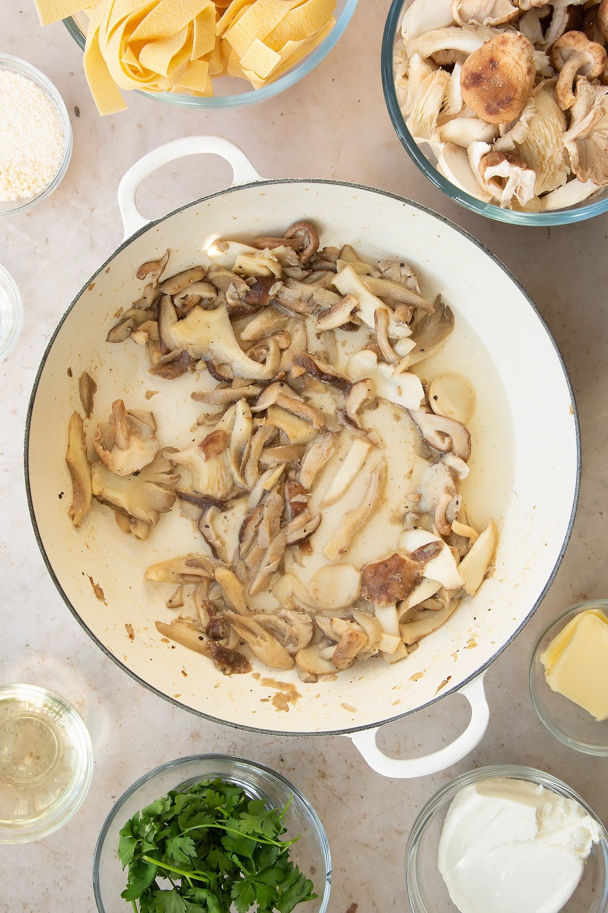 cooked garlic and mushrooms in a large pan with added wine.