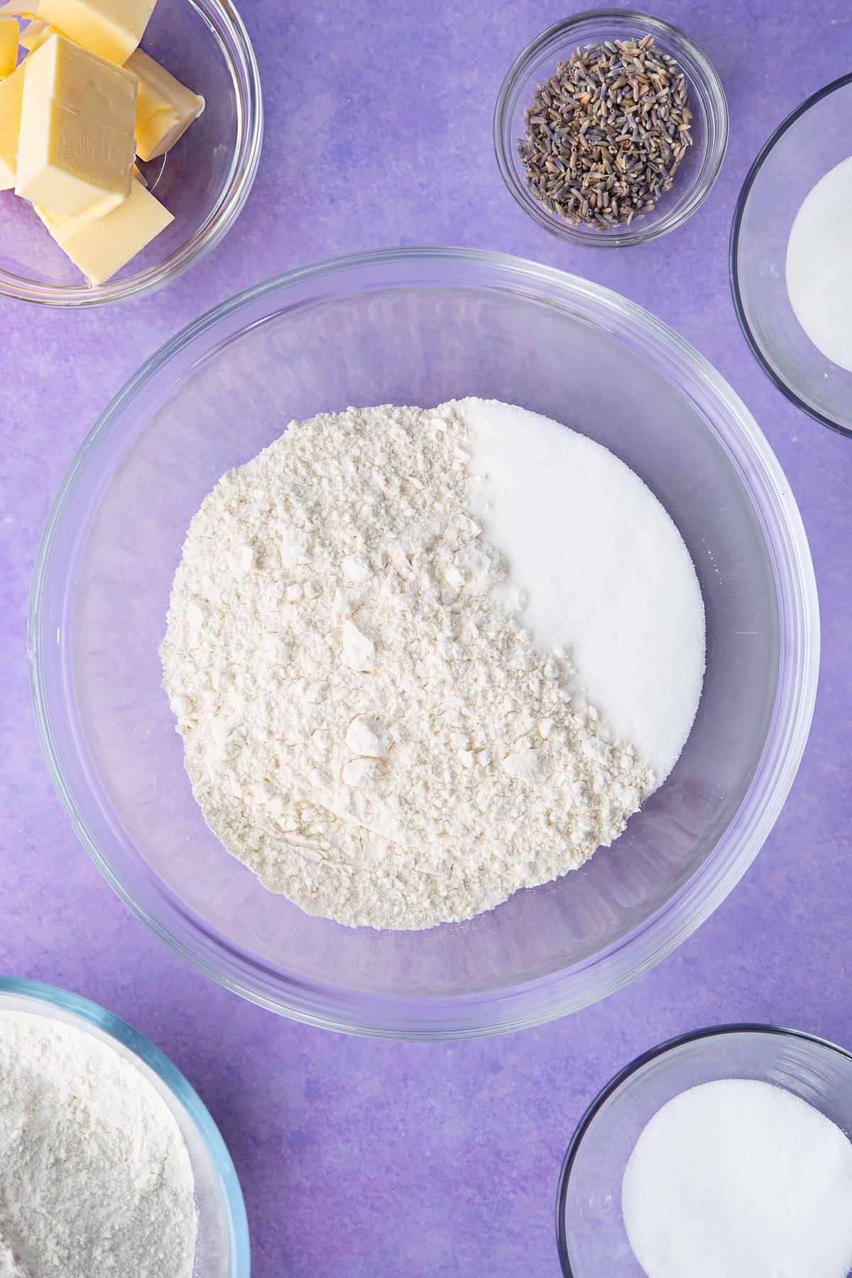 Flour and sugar in a bowl. Ingredients to make lavender shortbread cookies.