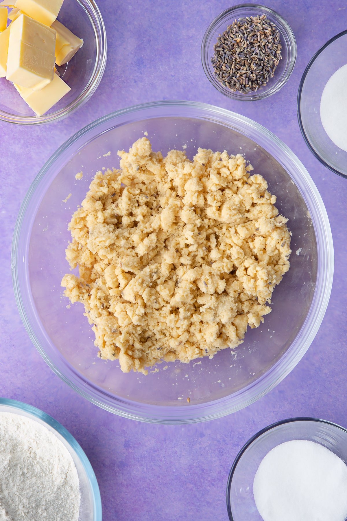 Lavender shortbread cookie dough in a mixing bowl.