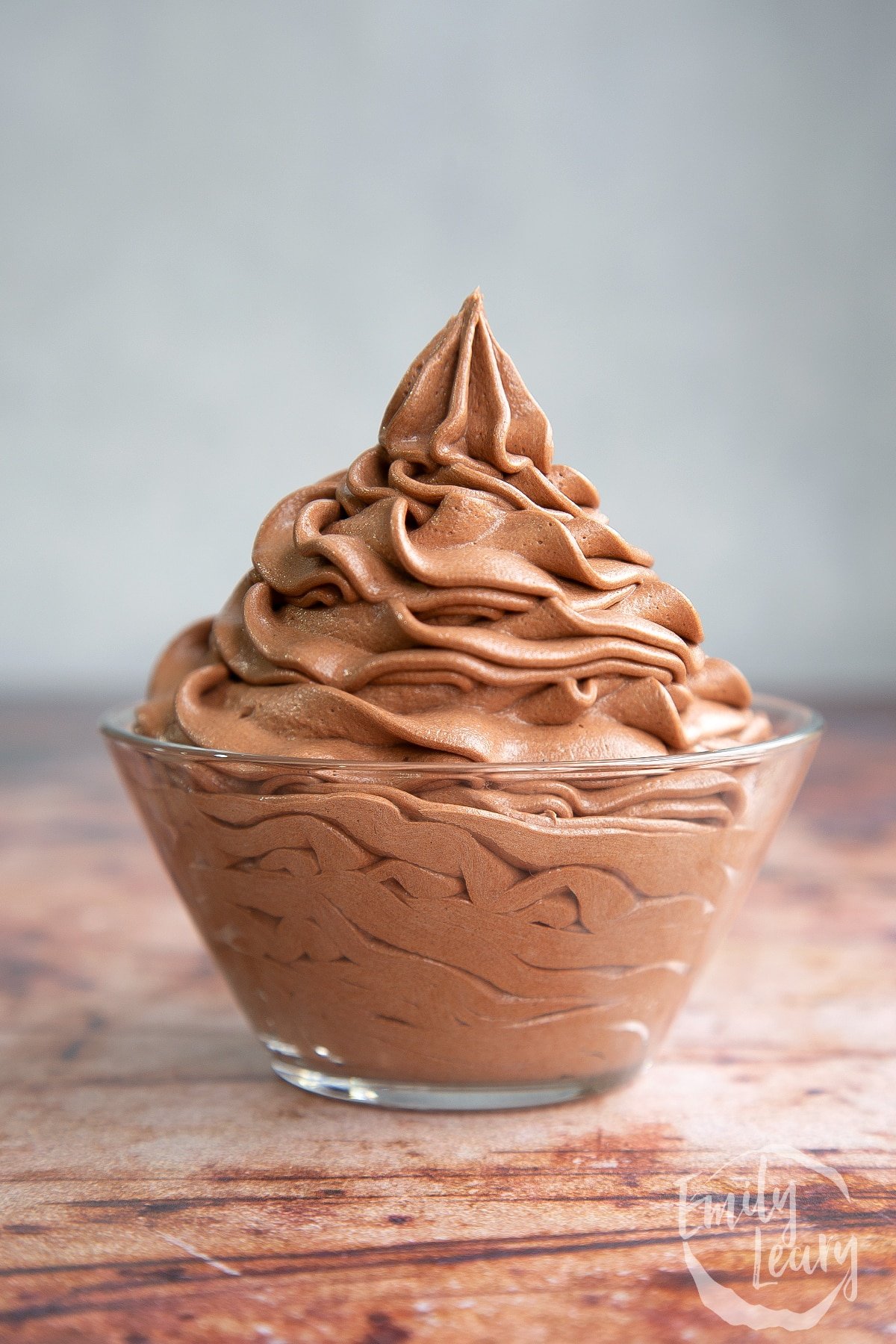 Nutella buttercream piped into a bowl.