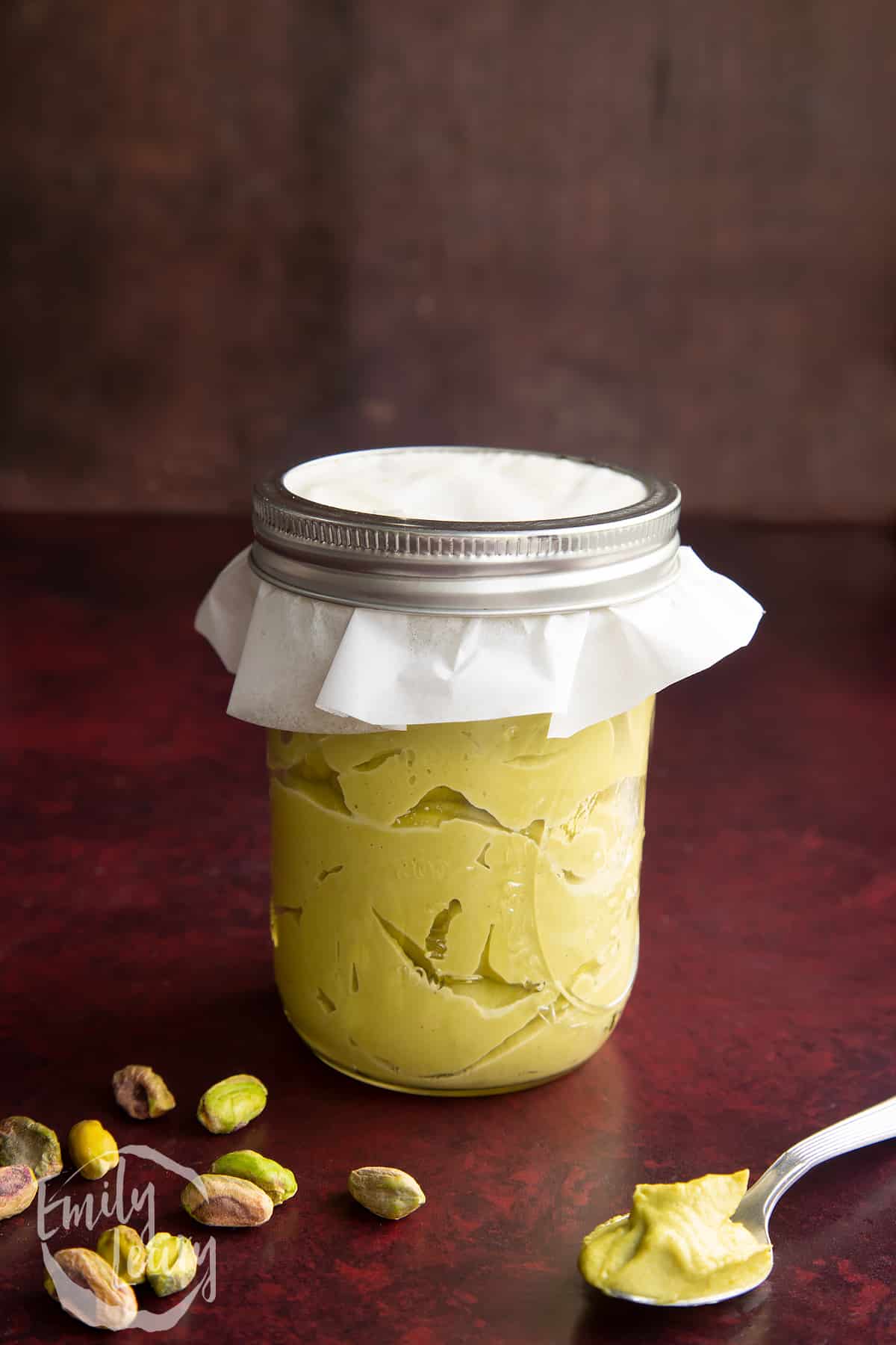 Overhead shot of the pistachio paste in a sealed jar.
