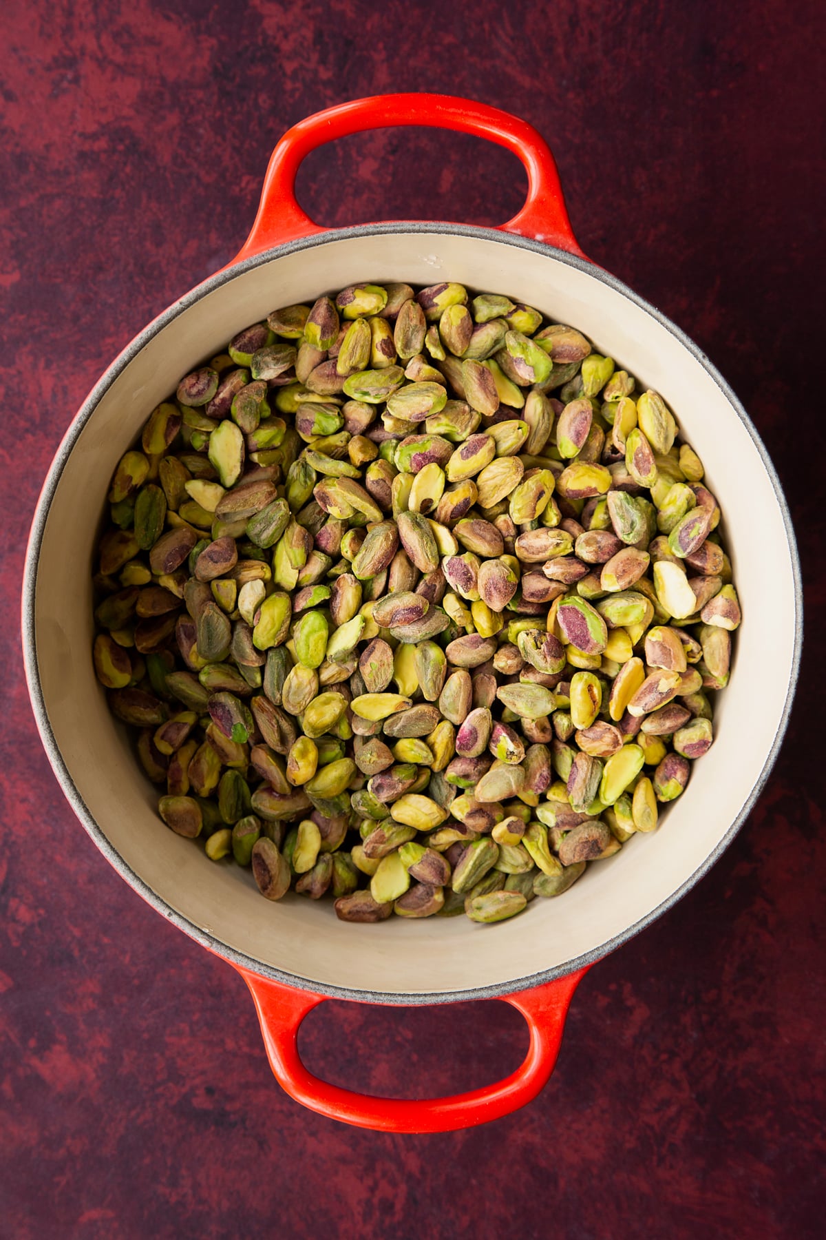 Overhead shot of the pistachios in a pan.