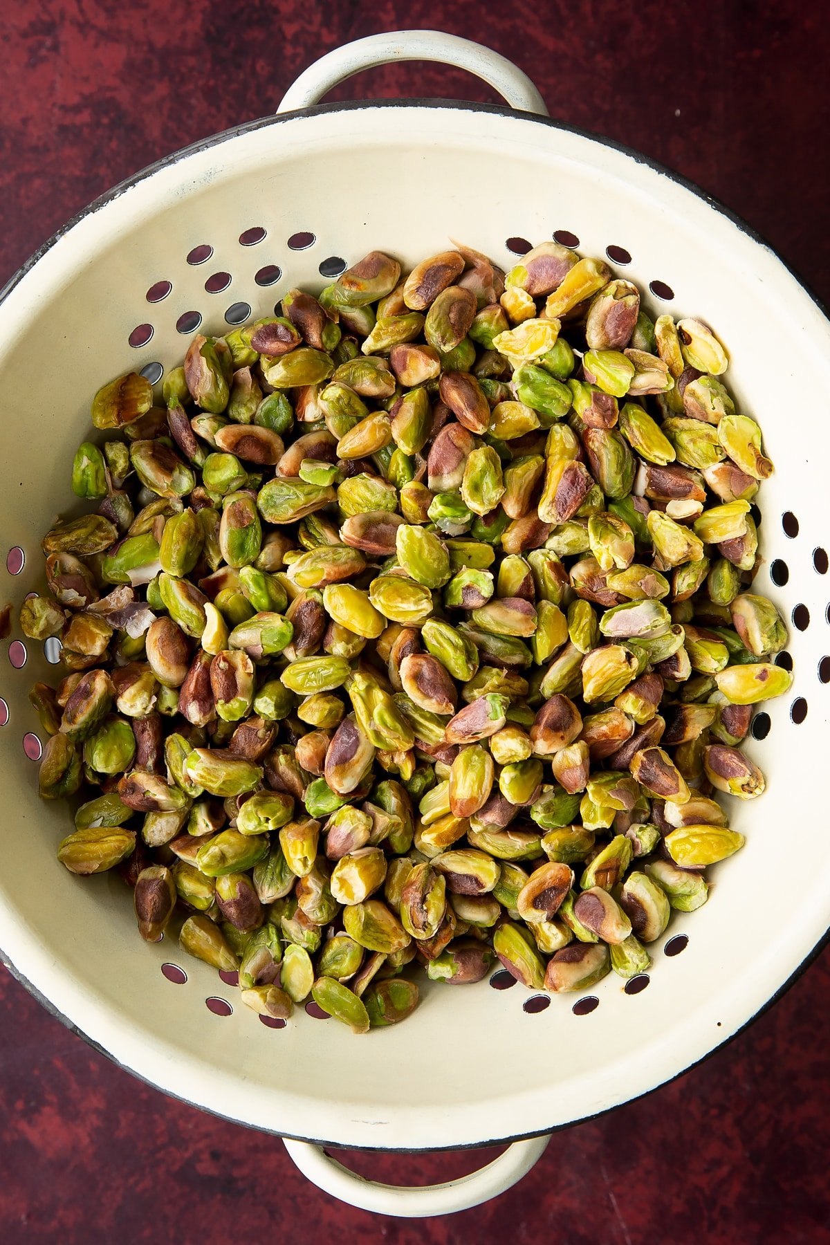 Overhead shot of the pistachios being drained.